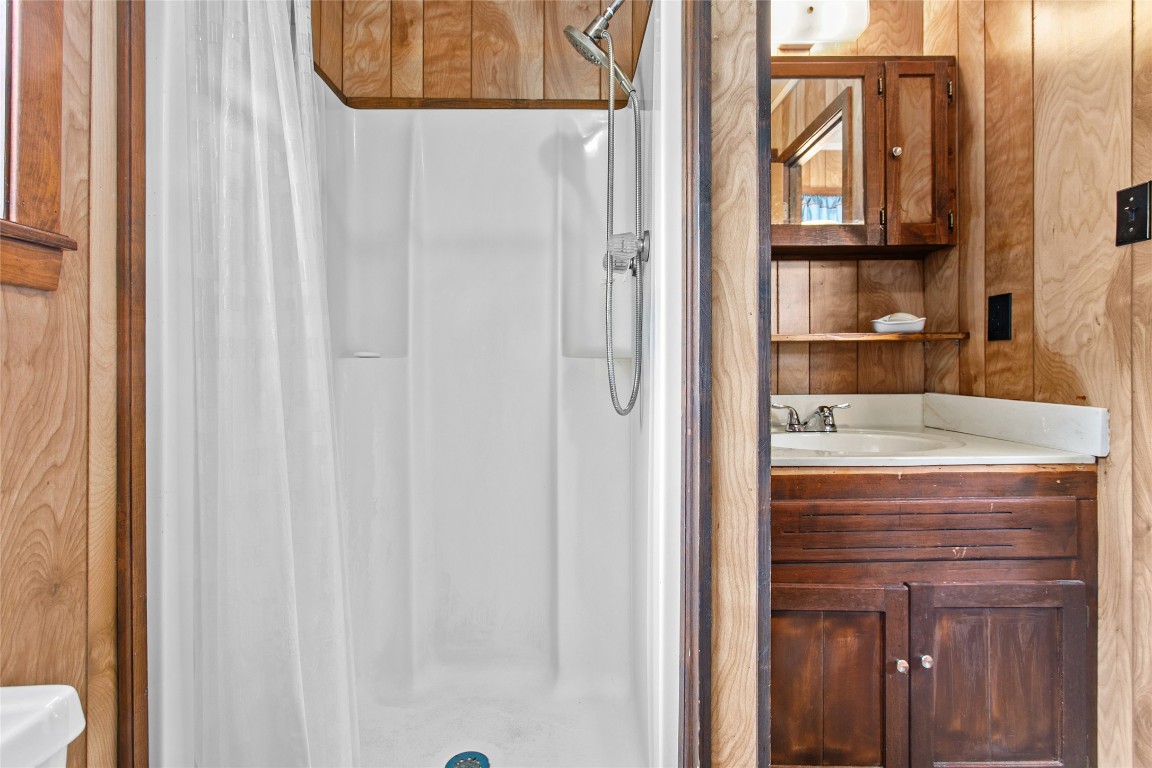1408 State Park Road Lockhart, TX 78644 - Photo 13 of 38 a view of bathroom with a sink and a mirror