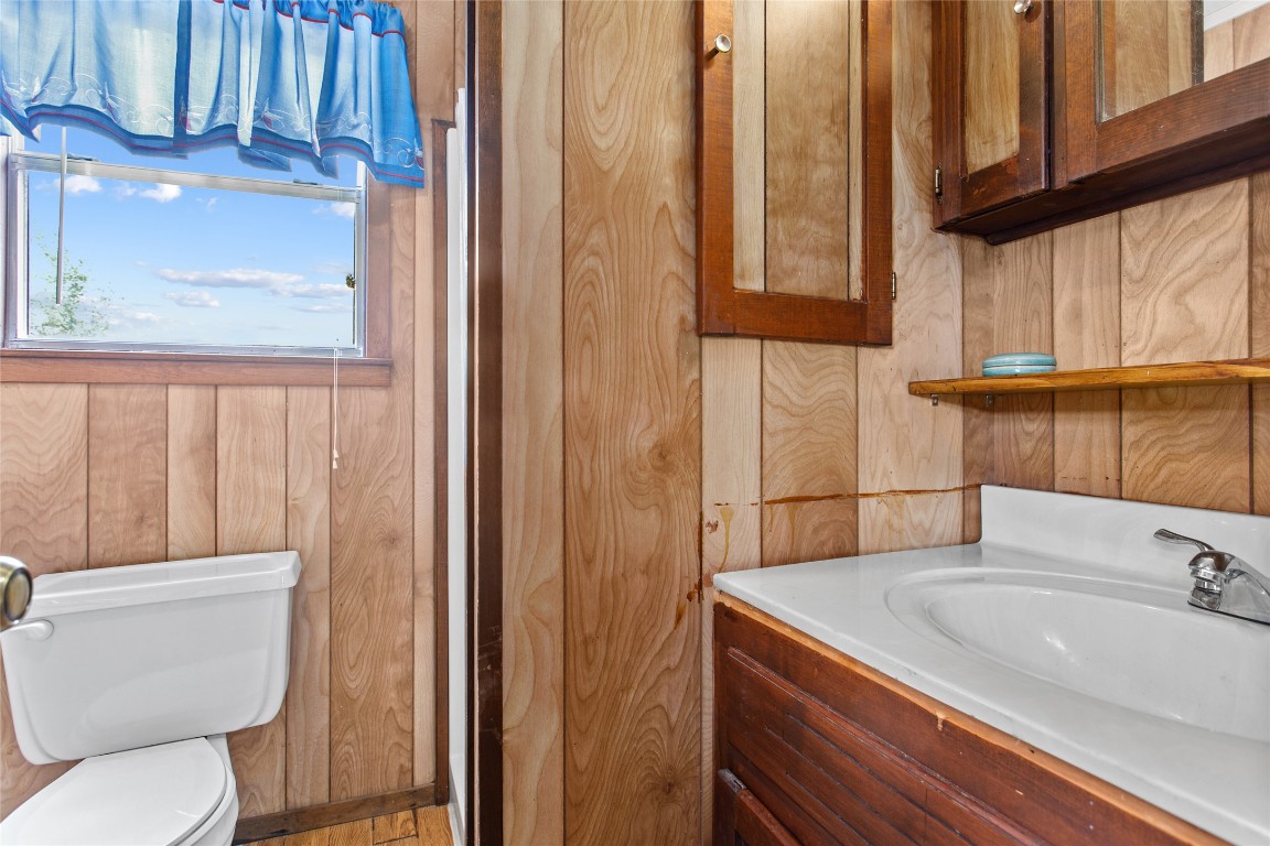 1408 State Park Road Lockhart, TX 78644 - Photo 14 of 38 a bathroom with a sink a toilet and shower