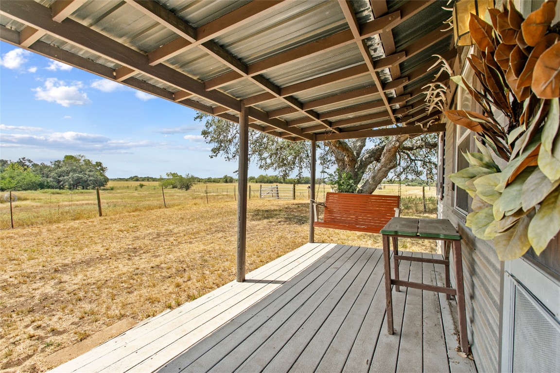1408 State Park Road Lockhart, TX 78644 - Photo 17 of 38 a view of a balcony with wooden floor