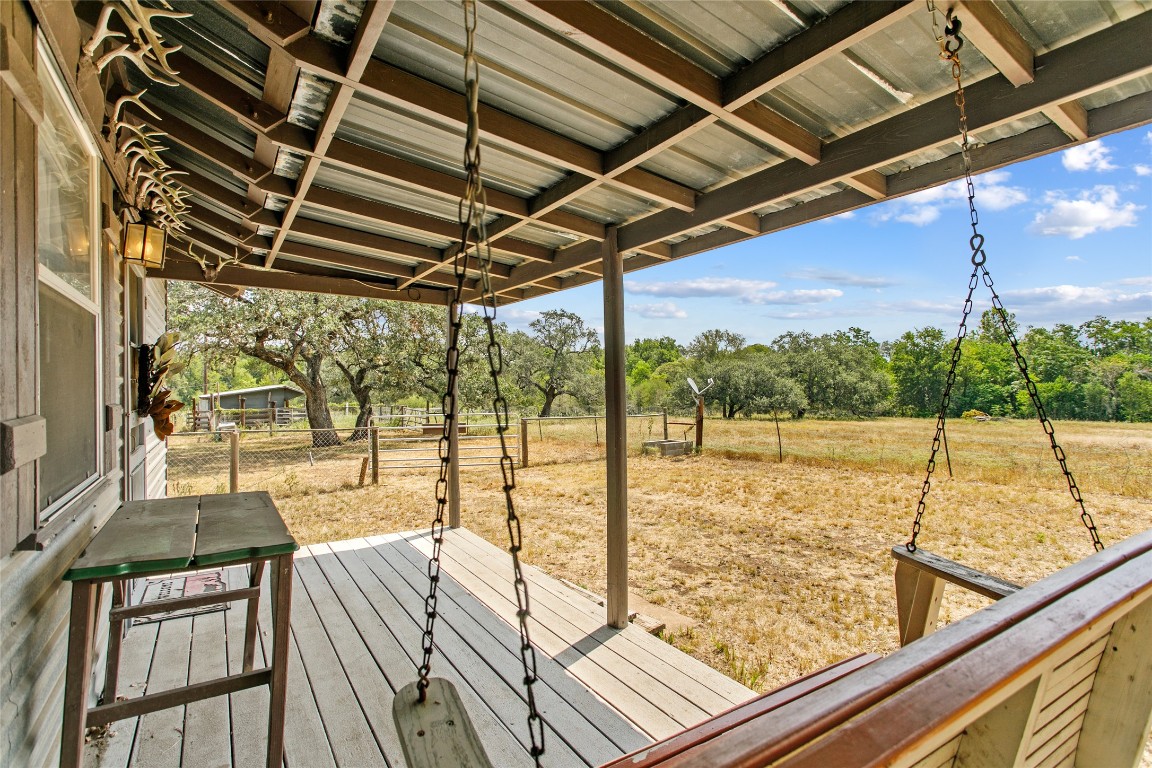 1408 State Park Road Lockhart, TX 78644 - Photo 18 of 38 a view of a balcony with wooden floor