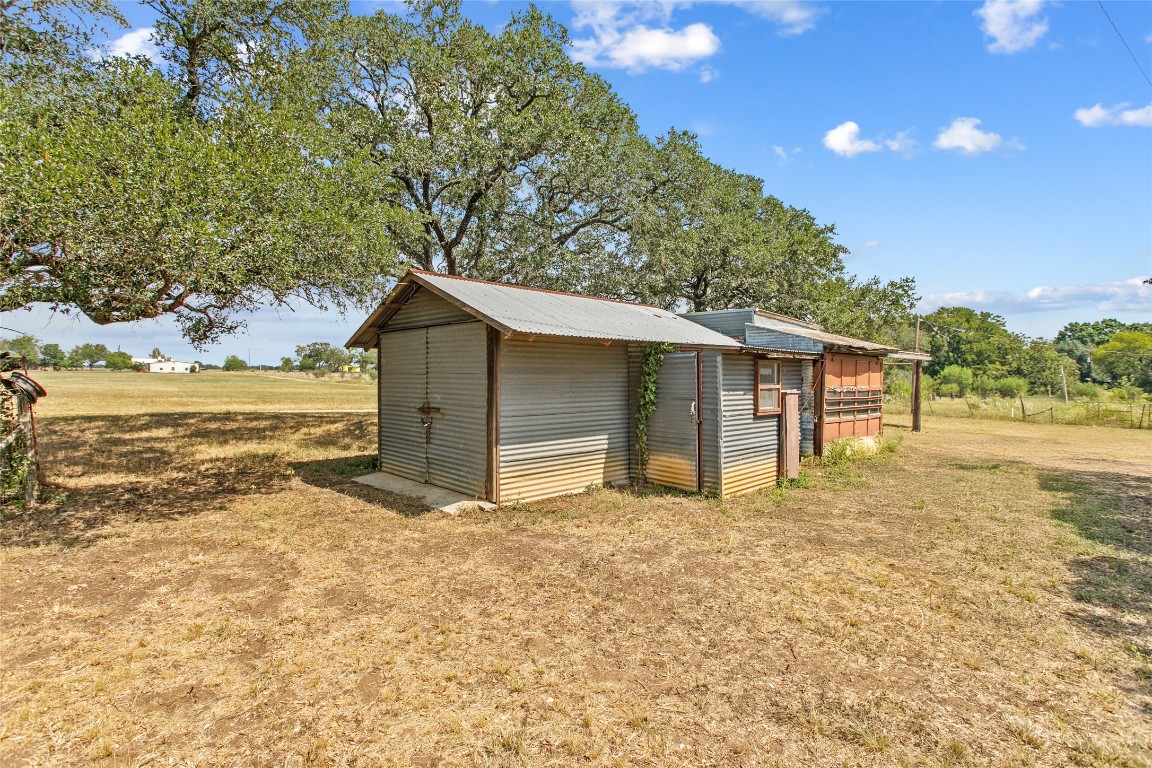 1408 State Park Road Lockhart, TX 78644 - Photo 23 of 38 a view of a house with a yard
