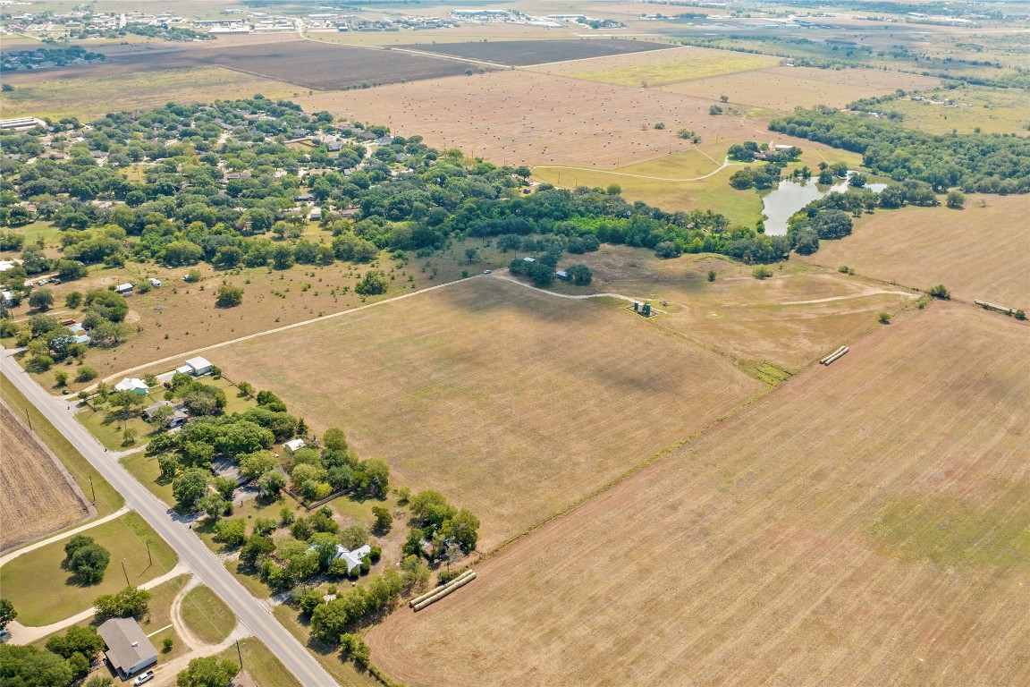1408 State Park Road Lockhart, TX 78644 - Photo 25 of 38 a view of a lake with a beach