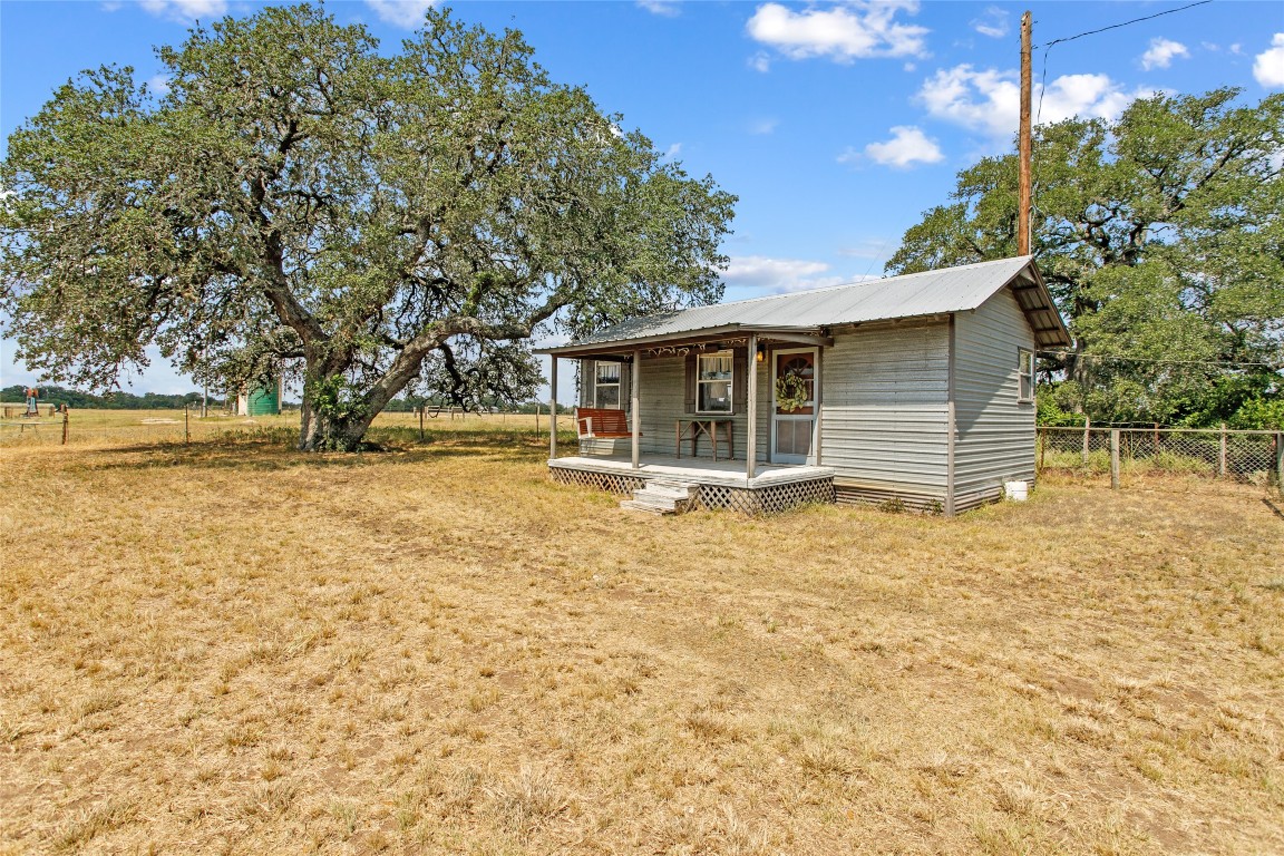 1408 State Park Road Lockhart, TX 78644 - Photo 6 of 38 a view of a house with a yard