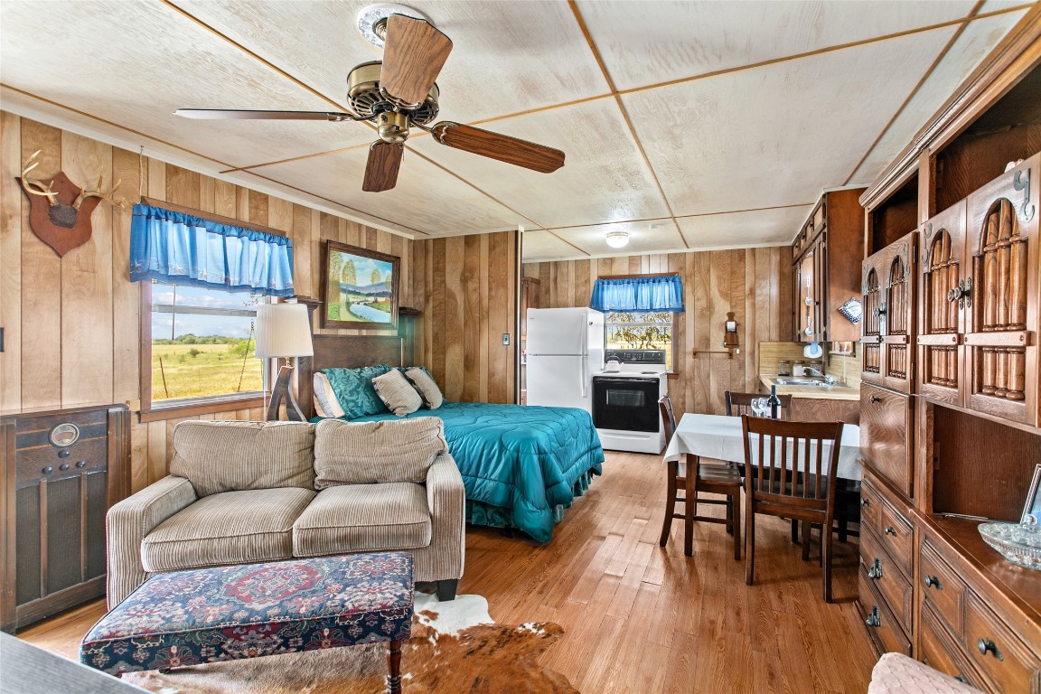 1408 State Park Road Lockhart, TX 78644 - Photo 7 of 38 a living room with furniture and a flat screen tv