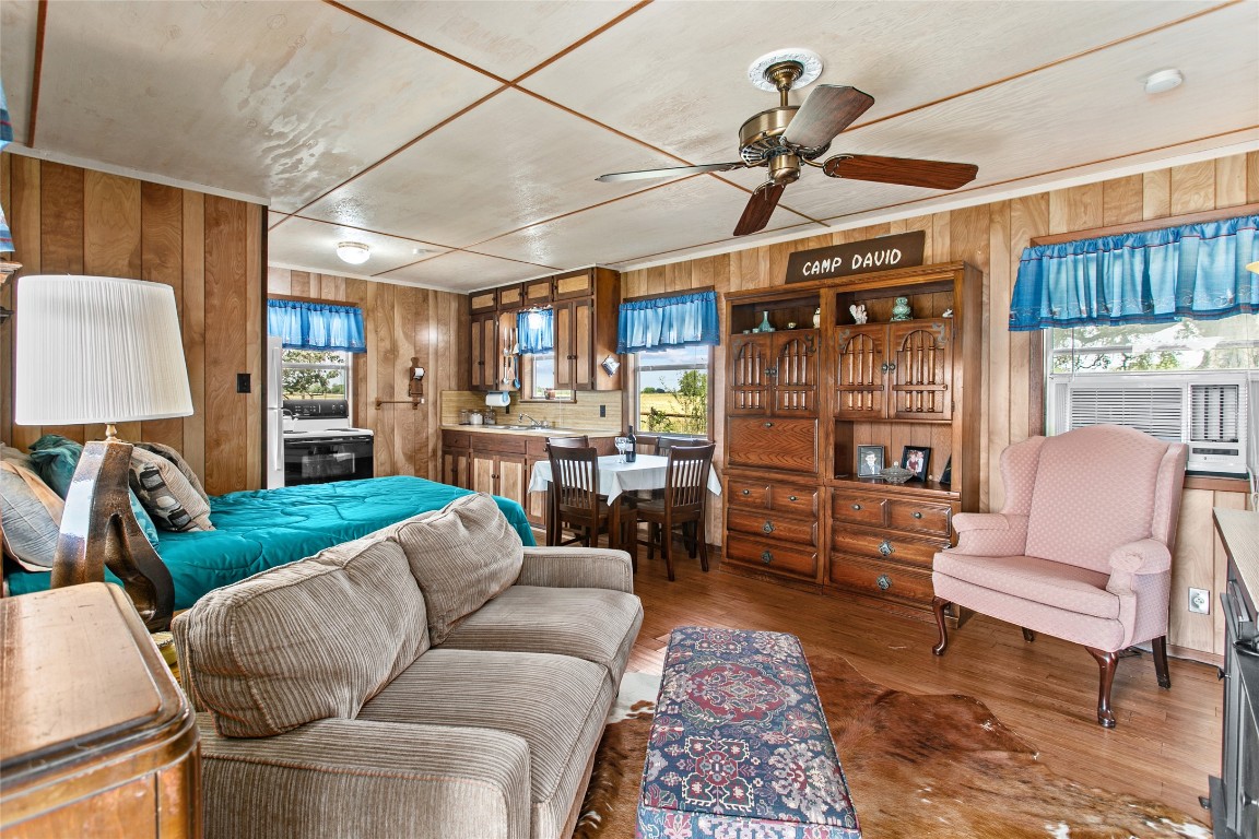 1408 State Park Road Lockhart, TX 78644 - Photo 9 of 38 a living room with furniture a ceiling fan and a window