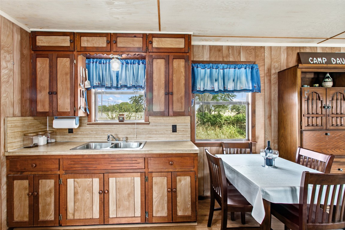 1408 State Park Road Lockhart, TX 78644 - Photo 10 of 38 a kitchen with a table chairs and a window
