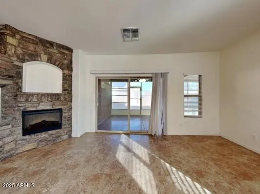 a bedroom with a bed and a fireplace