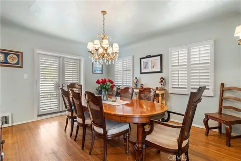 a kitchen with stainless steel appliances granite countertop a sink dishwasher stove top oven and cabinets