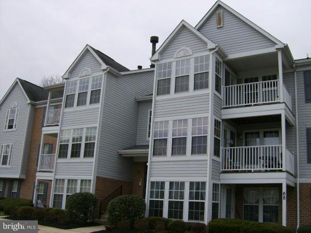 72 Laurel Path Court, Unit 3 Baltimore, MD 21236 - Photo 16 of 18 a view of a house with a yard