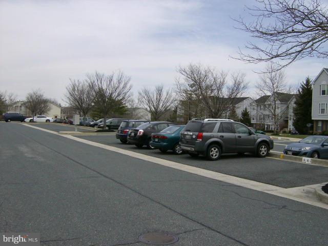 72 Laurel Path Court, Unit 3 Baltimore, MD 21236 - Photo 17 of 18 a view of a cars parked on the side of a street