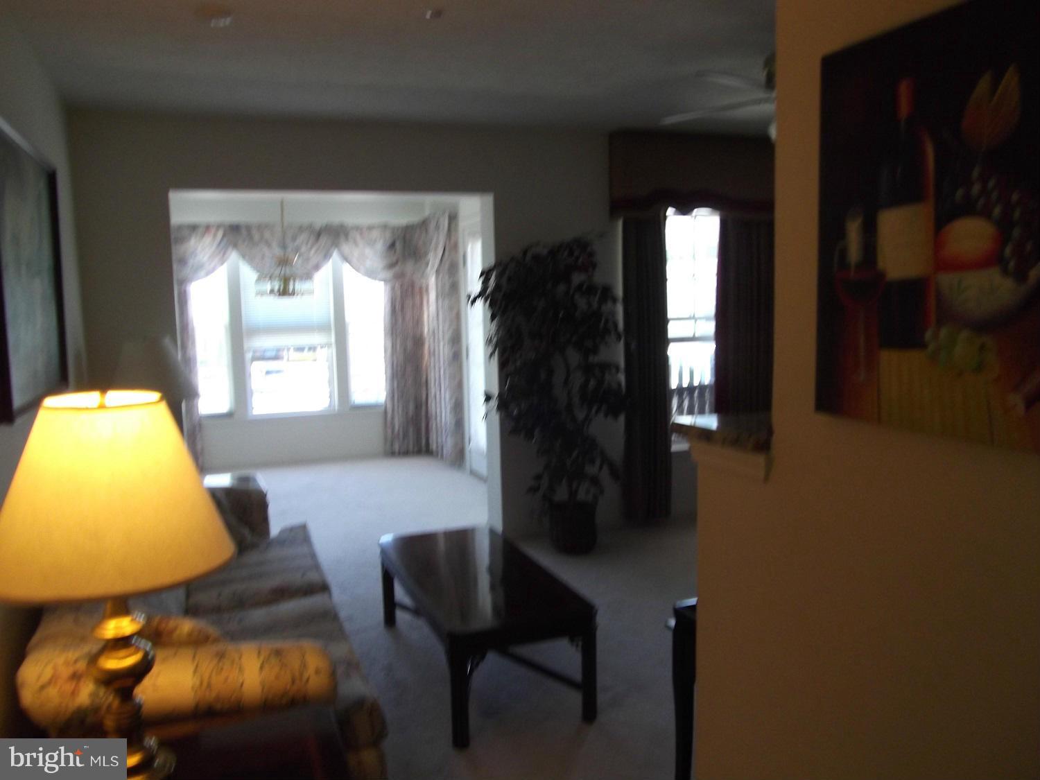 72 Laurel Path Court, Unit 3 Baltimore, MD 21236 - Photo 4 of 18 a living room with furniture and a window