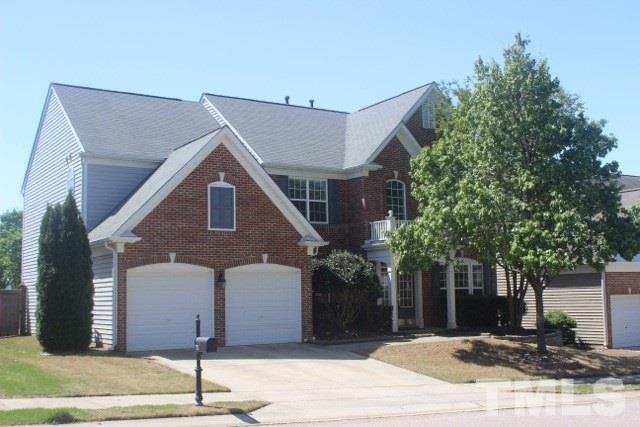 7729 Silver View Lane Raleigh, NC 27613 - Photo 1 of 25 a front view of a house with a tree