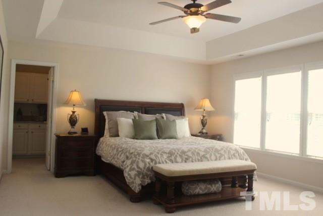 7729 Silver View Lane Raleigh, NC 27613 - Photo 12 of 25 a bedroom with a bed and window