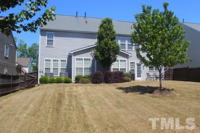 7729 Silver View Lane Raleigh, NC 27613 - Photo 20 of 25 a front view of a house with a yard and garage