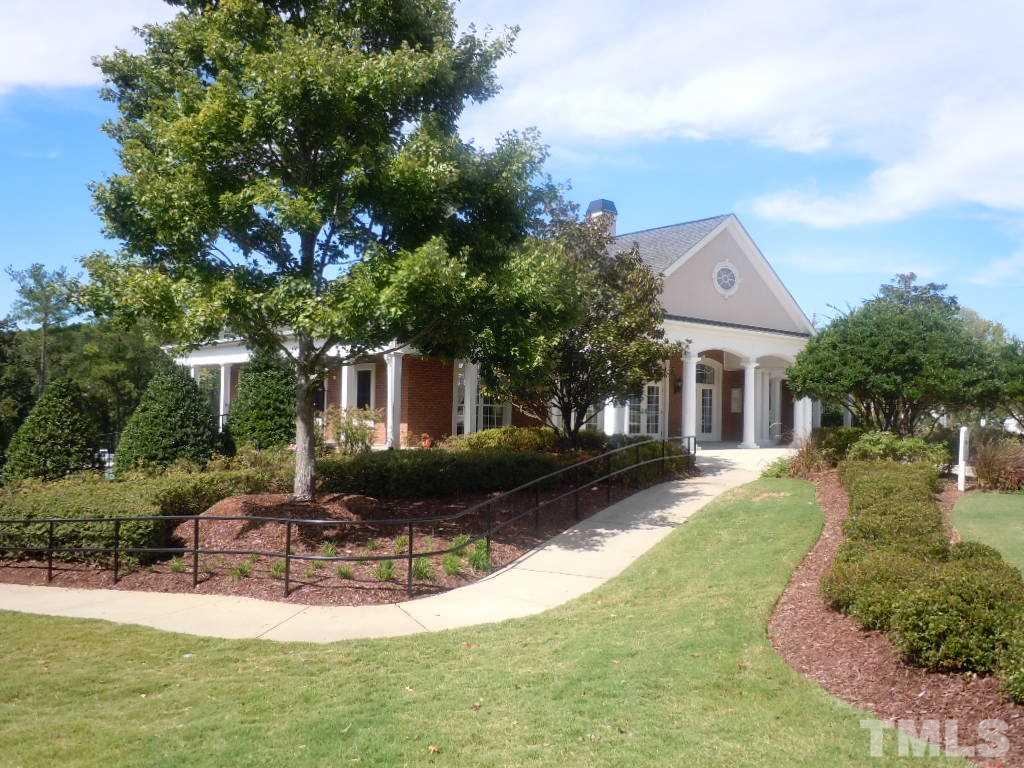 7729 Silver View Lane Raleigh, NC 27613 - Photo 23 of 25 a front view of a house with a yard