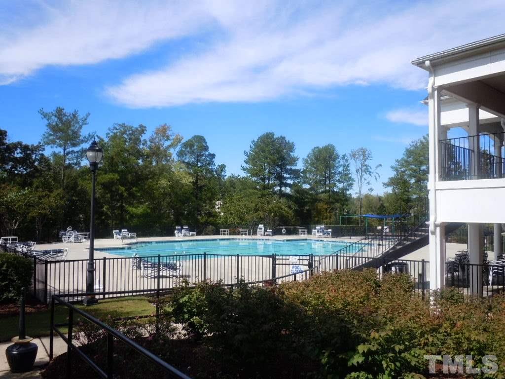 7729 Silver View Lane Raleigh, NC 27613 - Photo 24 of 25 a view of a balcony with chairs and iron fence