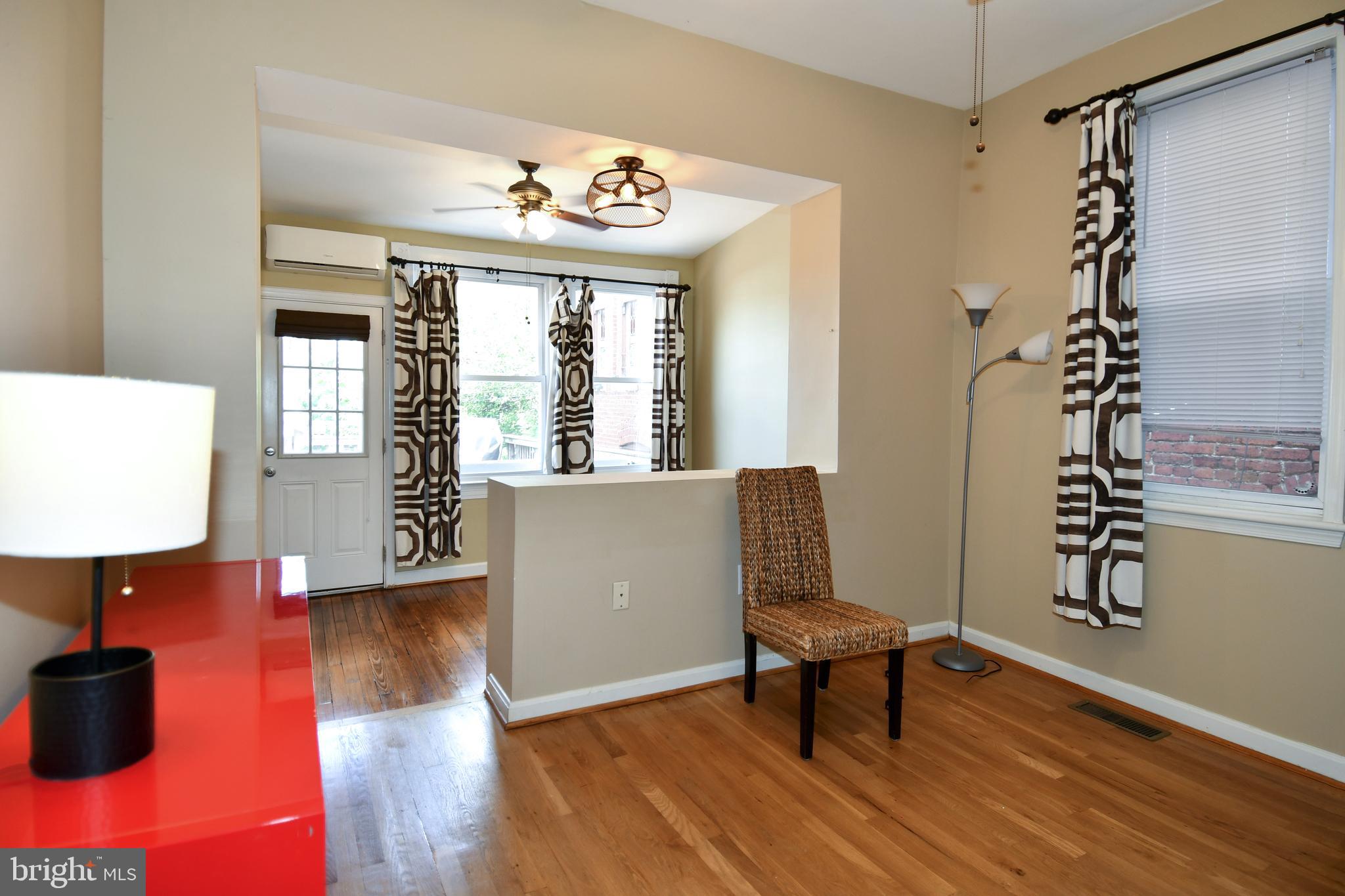 11 R Street Northwest Washington, DC 20001 - Photo 20 of 55 a view of a room with furniture a chandelier and wooden floor
