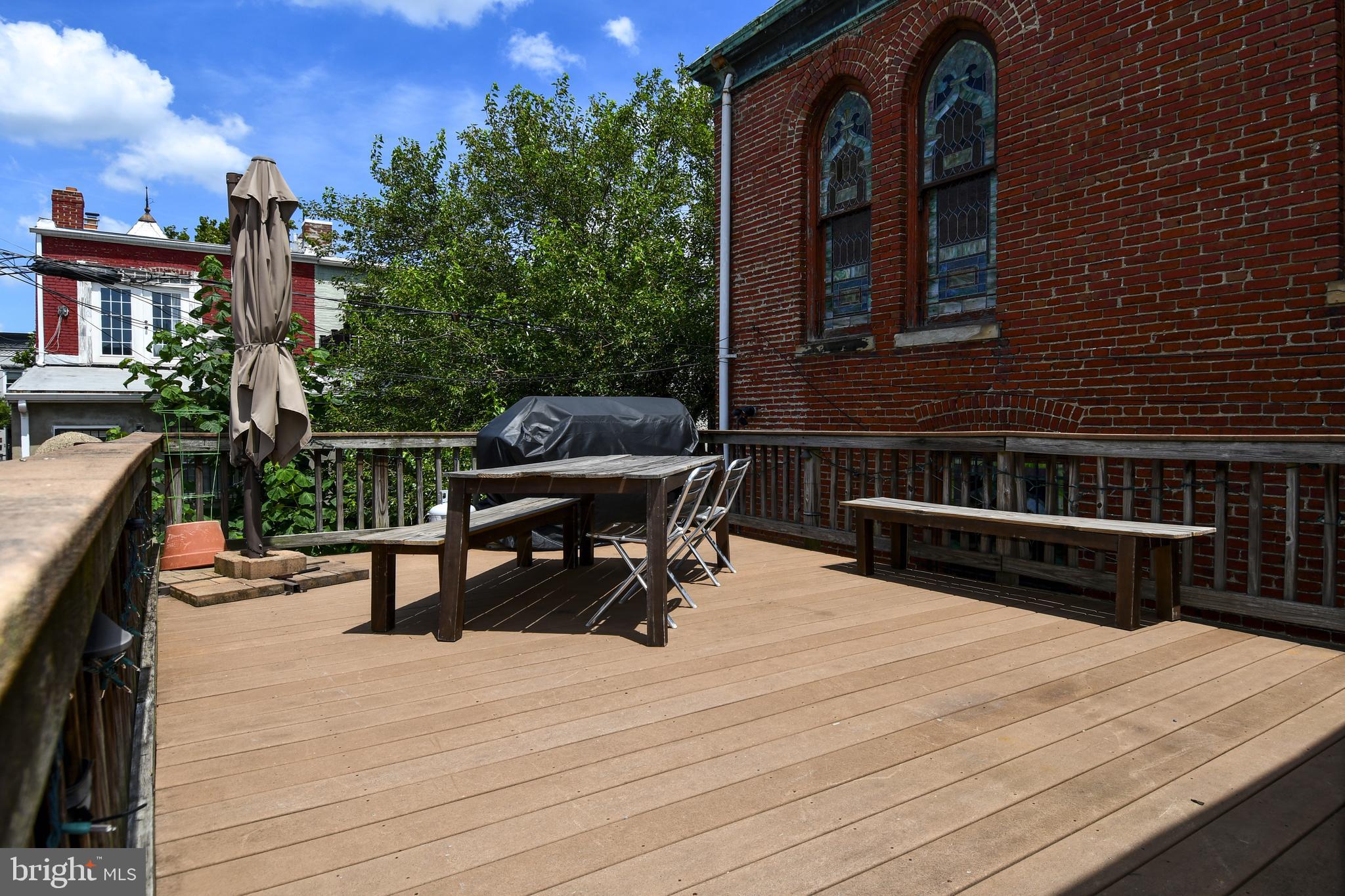 11 R Street Northwest Washington, DC 20001 - Photo 23 of 55 a view of a roof deck with chair and tables