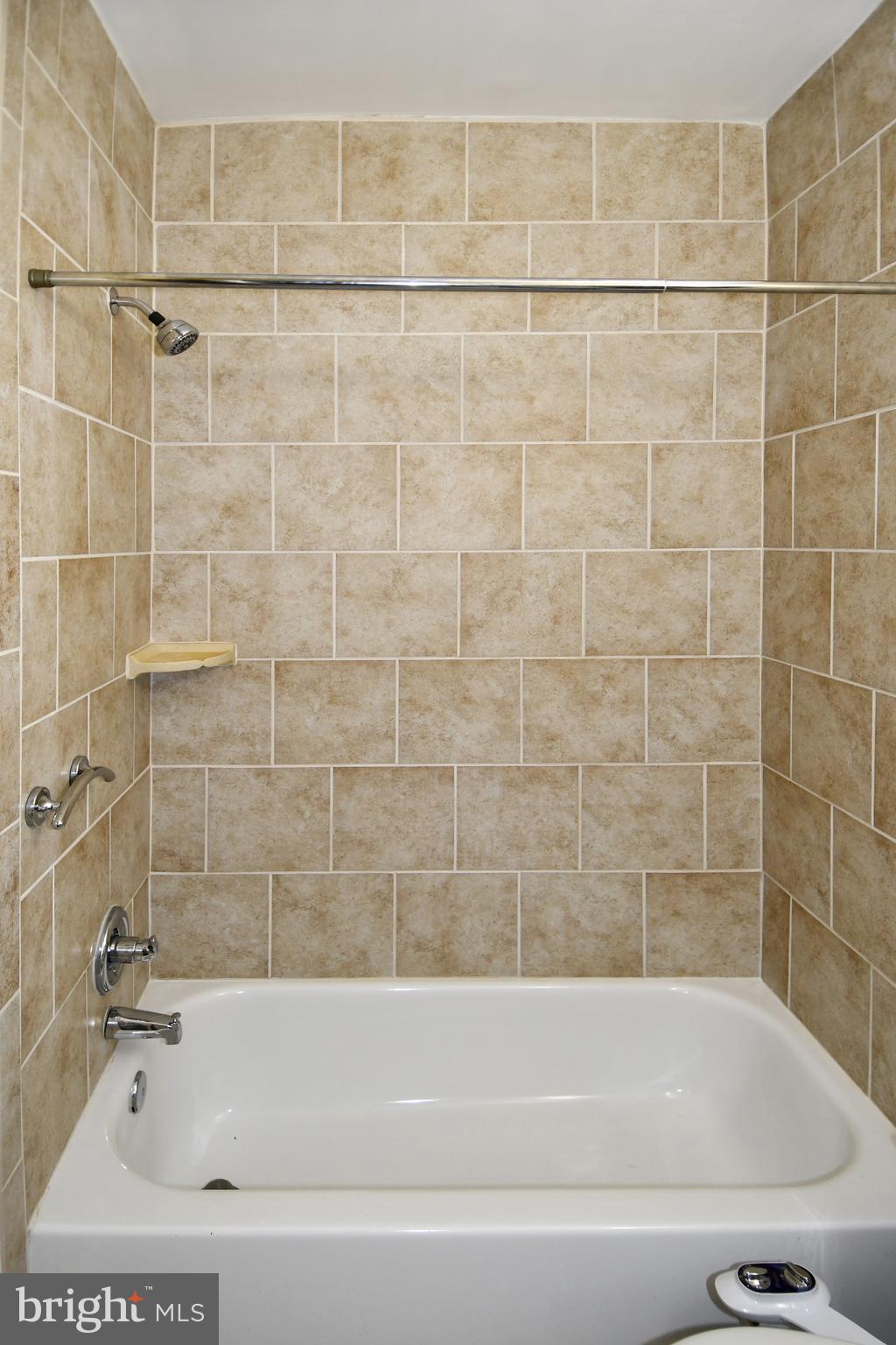 11 R Street Northwest Washington, DC 20001 - Photo 26 of 55 a bathroom with a bathtub and a shower