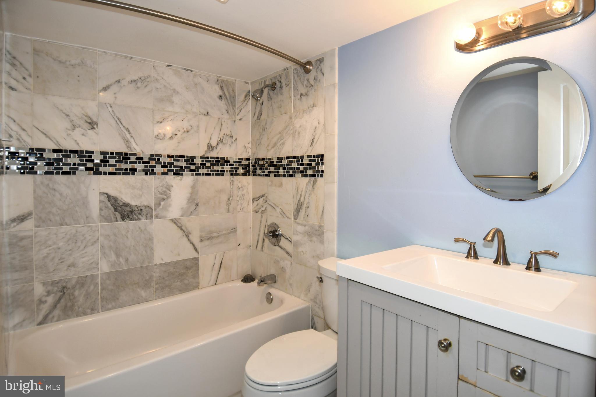 11 R Street Northwest Washington, DC 20001 - Photo 39 of 55 a bathroom with a sink toilet and shower