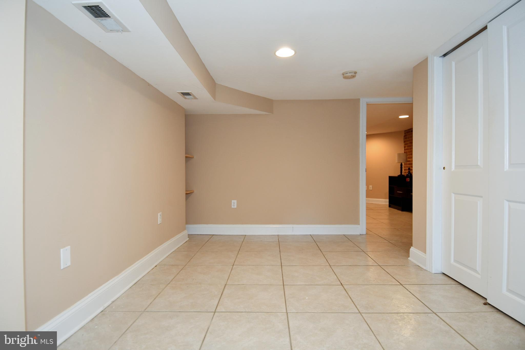 11 R Street Northwest Washington, DC 20001 - Photo 44 of 55 a view of an empty room with a window