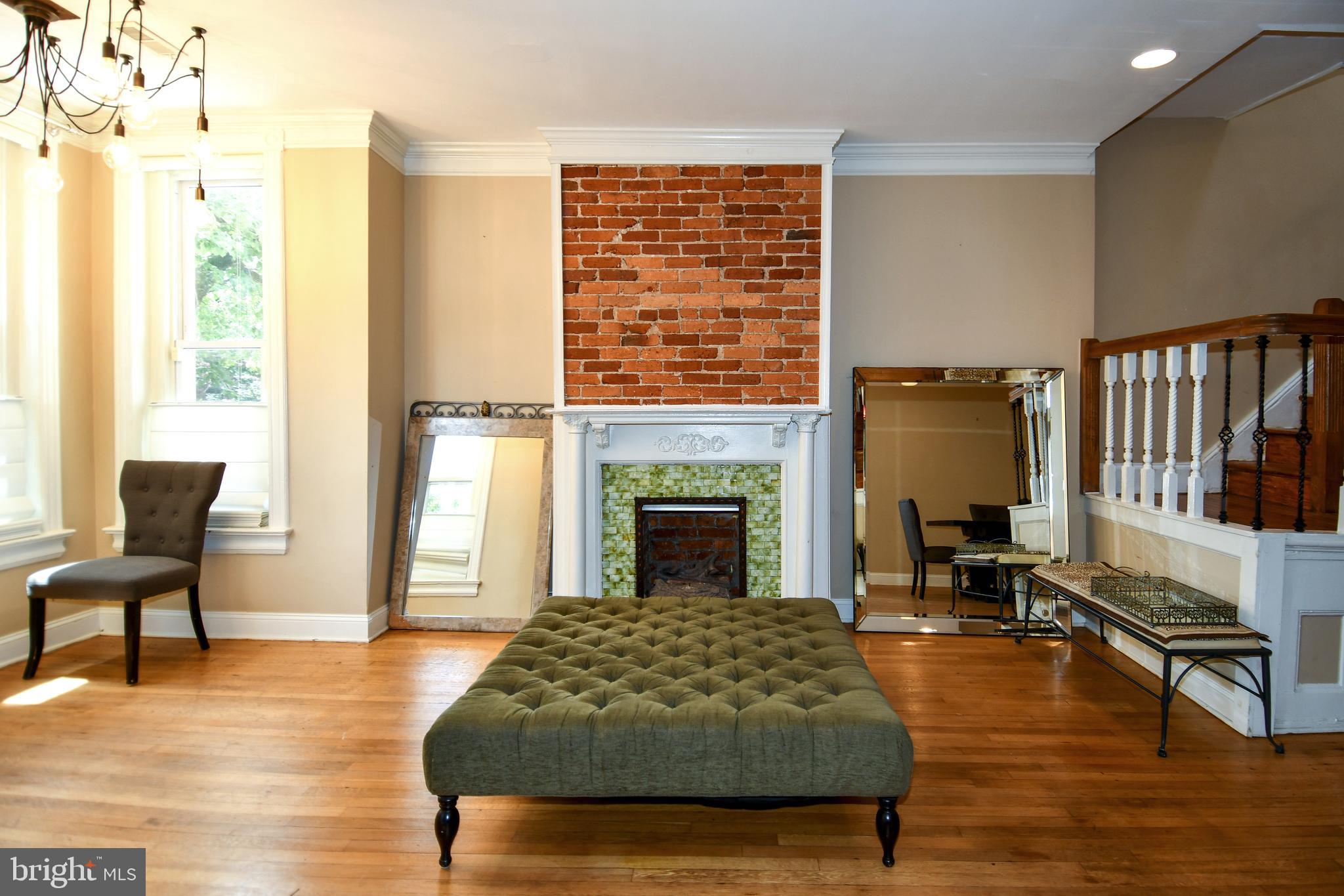 11 R Street Northwest Washington, DC 20001 - Photo 5 of 55 a living room with furniture and a fireplace