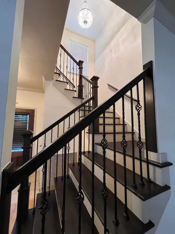 a view of a patio with chairs and a table