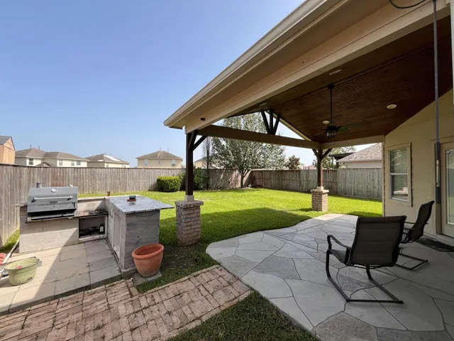 a view of a hallway with wooden floor and stairs