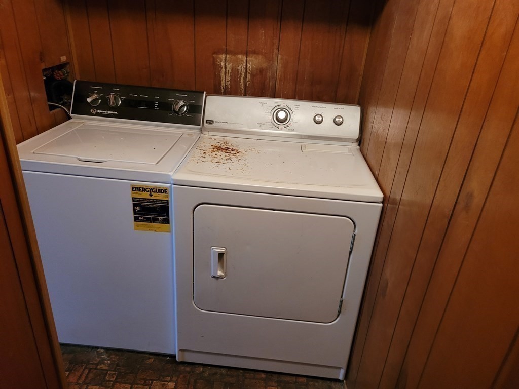 286 Newbury Street, Unit 75 Peabody, MA 01960 - Photo 11 of 18 a utility room with dryer and washer