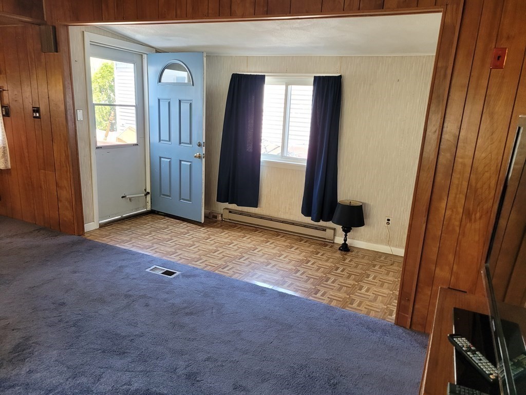 286 Newbury Street, Unit 75 Peabody, MA 01960 - Photo 12 of 18 an empty room with windows