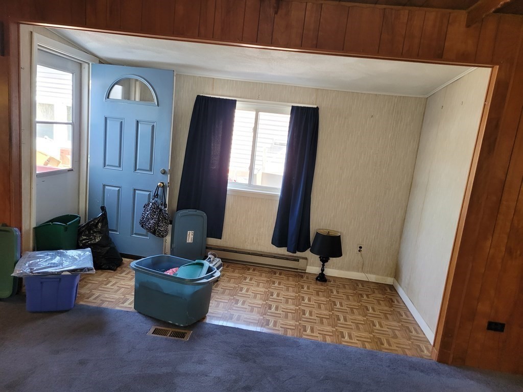 286 Newbury Street, Unit 75 Peabody, MA 01960 - Photo 17 of 18 a room with furniture and window