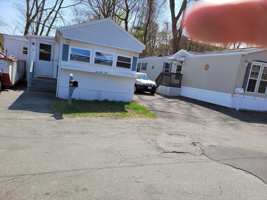 286 Newbury Street, Unit 75 Peabody, MA 01960 - Photo 2 of 18 a view of a house with a yard