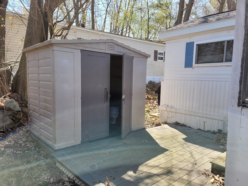 286 Newbury Street, Unit 75 Peabody, MA 01960 - Photo 7 of 18 a view of a house with a yard