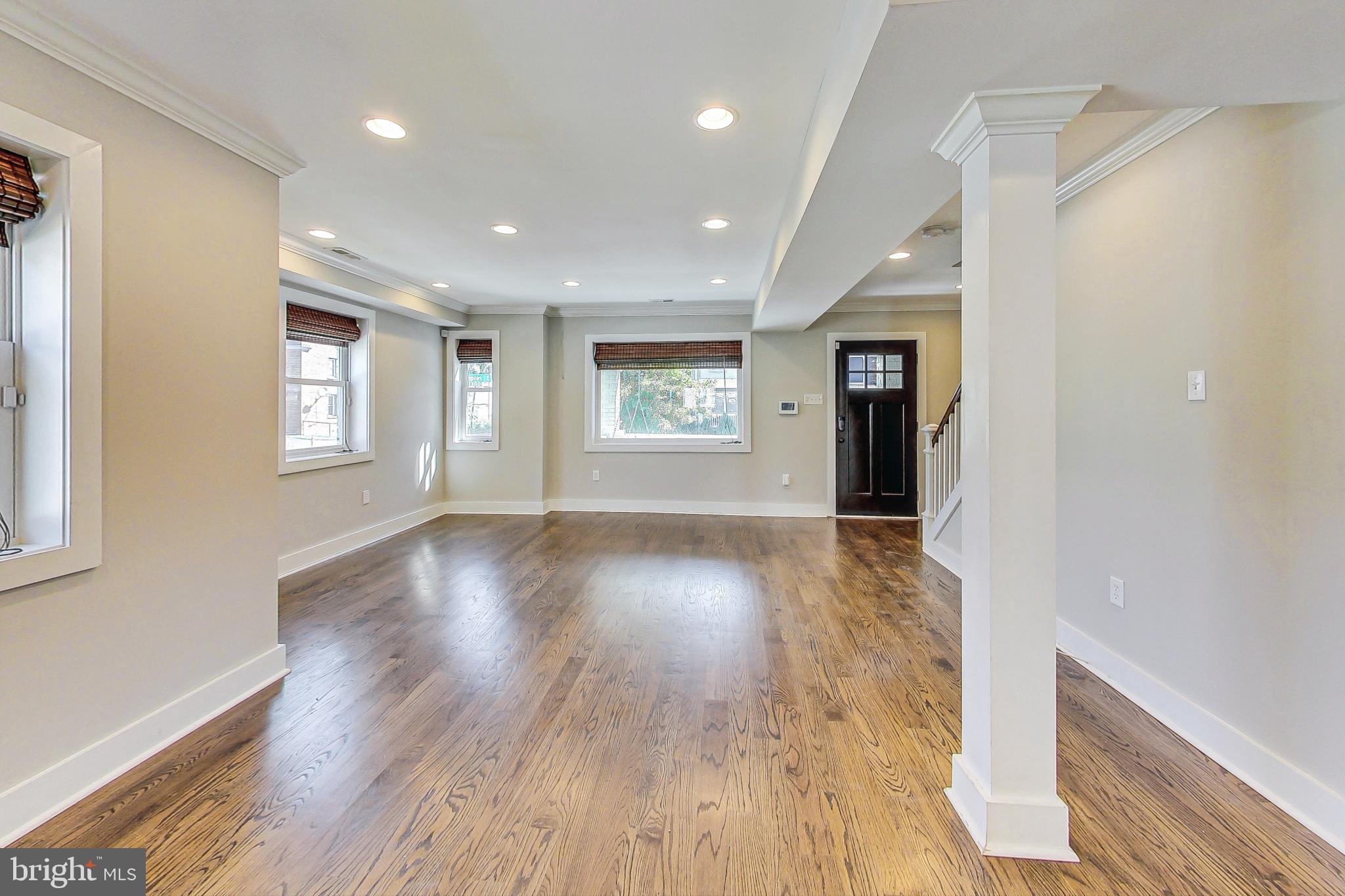 1330 Staples Street Northeast Washington, DC 20002 - Photo 11 of 64 a view of an empty room with wooden floor and a window