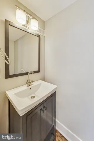 a bathroom with a double vanity sink mirror and