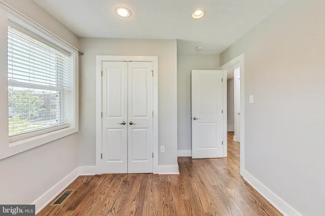 a view of a balcony with wooden floor
