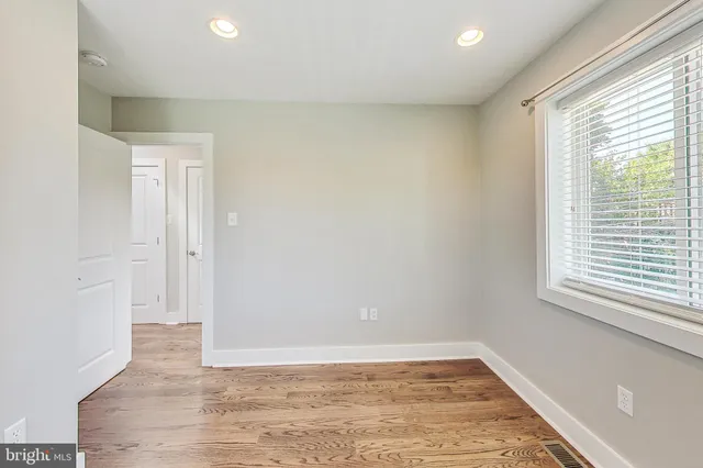 a view of a house with a small yard and a small yard