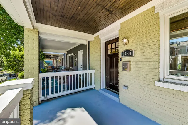 a view of a deck with wooden floor and fence