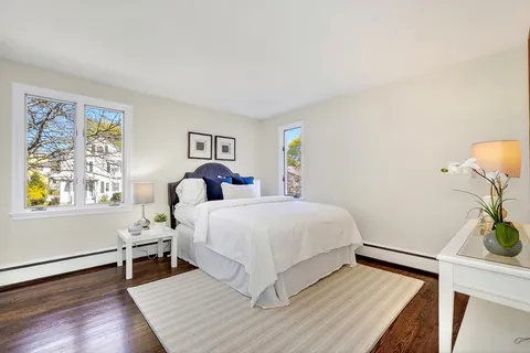 a bed room with a bed and a window