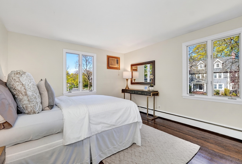 26 Garfield Road Melrose, MA 02176 - Photo 19 of 42 a bedroom with a bed wooden floor and a large window