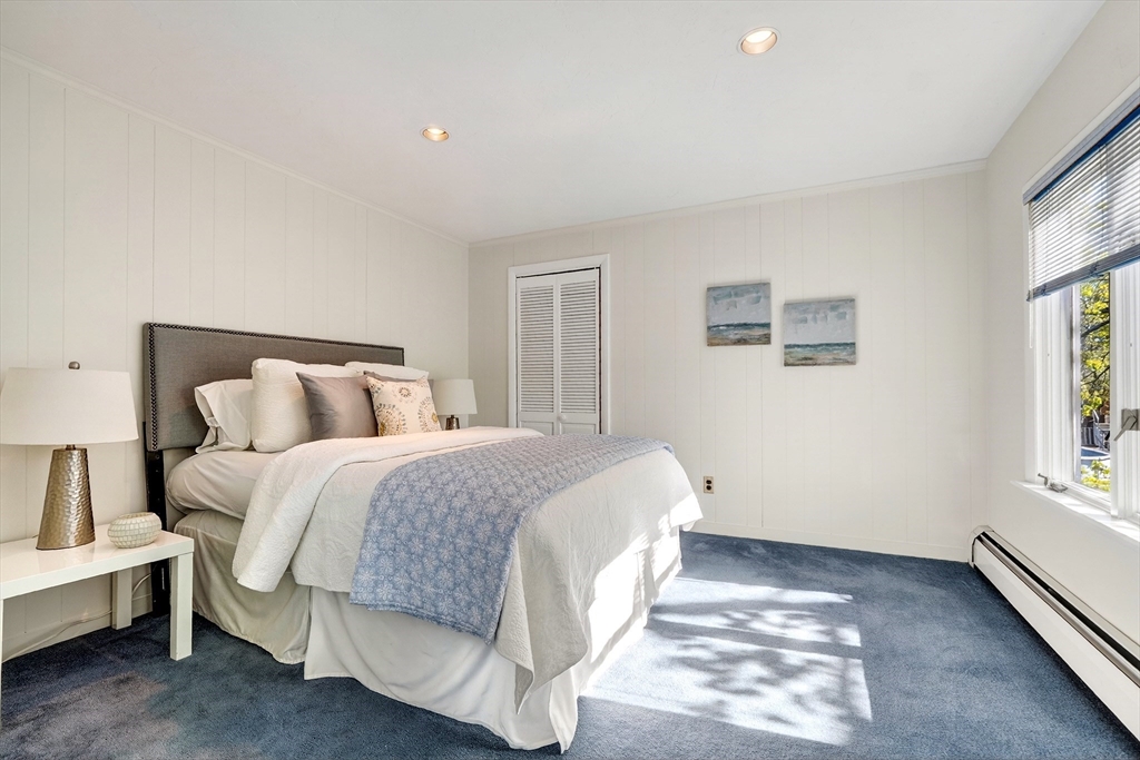 26 Garfield Road Melrose, MA 02176 - Photo 24 of 42 a spacious bedroom with a bed and a window