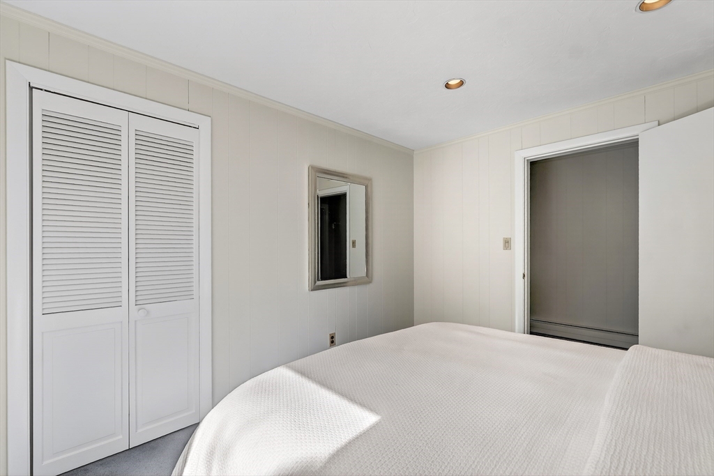 26 Garfield Road Melrose, MA 02176 - Photo 29 of 42 a bedroom with a bed and a window