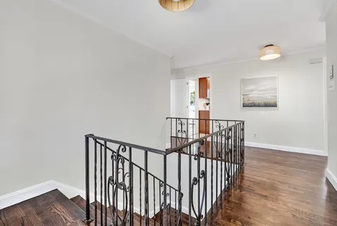 a view of entryway with wooden floor