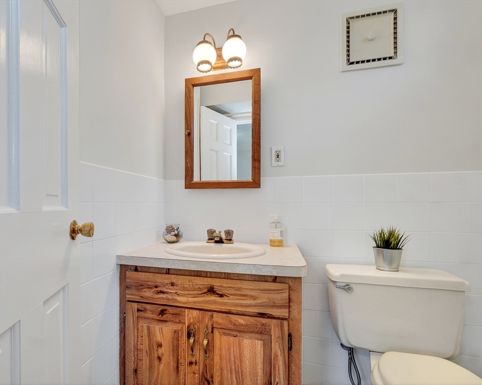 26 Garfield Road Melrose, MA 02176 - Photo 33 of 42 a bathroom with a toilet sink and mirror