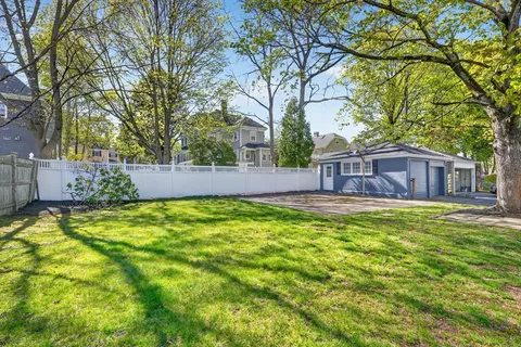 a view of a big yard next to a house