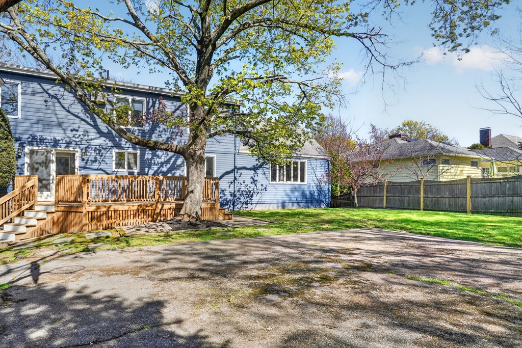 26 Garfield Road Melrose, MA 02176 - Photo 41 of 42 a view of a big yard next to a house