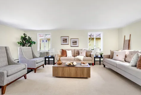 a living room with furniture and windows