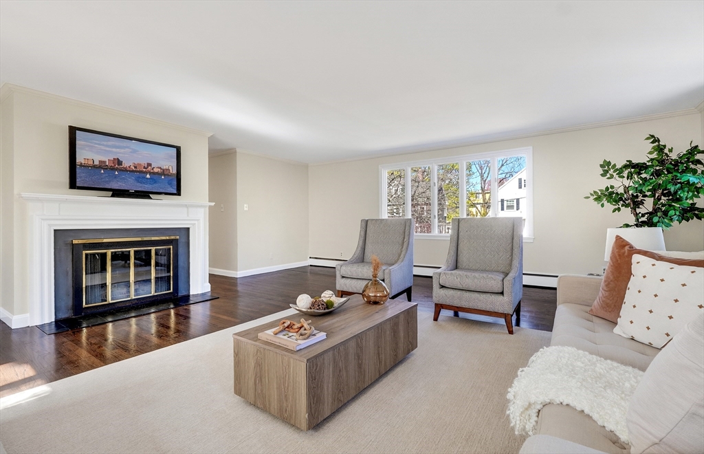 26 Garfield Road Melrose, MA 02176 - Photo 7 of 42 a living room with furniture a fireplace and a large window