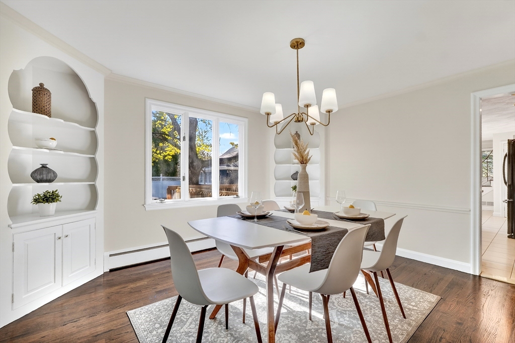 26 Garfield Road Melrose, MA 02176 - Photo 9 of 42 a view of a dining room with furniture wooden floor and chandelier