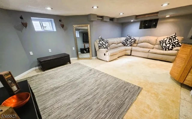 a bedroom with a bed window and couch